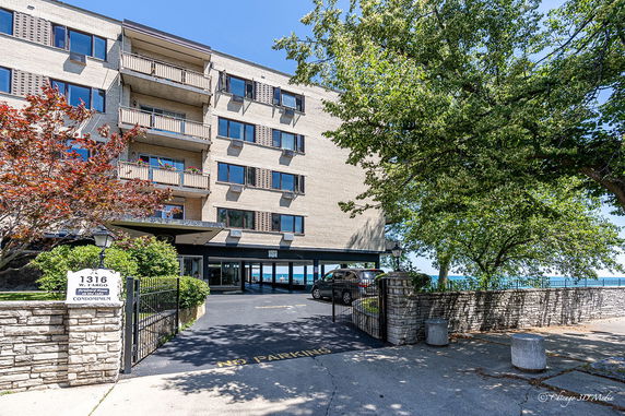 Front view of a multi-story condominium building.
