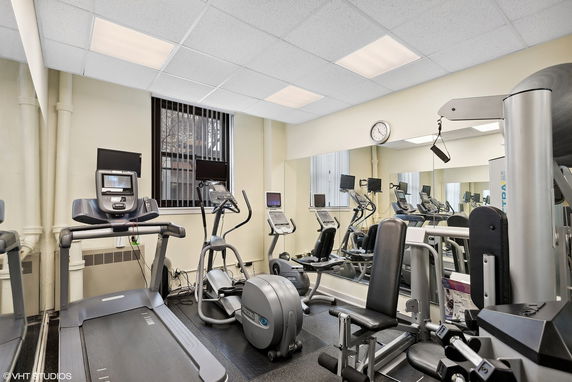 Indoor gym area with exercise equipment.