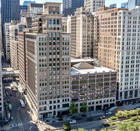 Front view of a high-rise building in a cityscape.