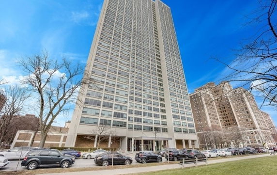 Front view of a tall residential building with multiple floors