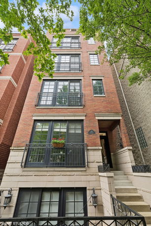 Front view of a multi-story brick building.