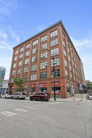 Front view of a multi-story brick building.