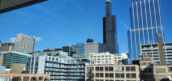 Panoramic view of a city skyline with multiple high-rise buildings.