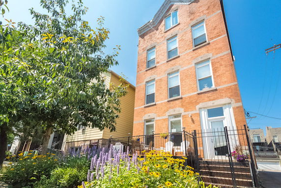 Front view of a multi-story brick building.