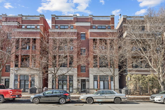 Front view of a multi-story brick residential building.