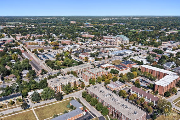 Aerial view of a town with multiple buildings and roads.