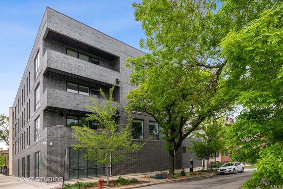 Front view of a four-story brick building.