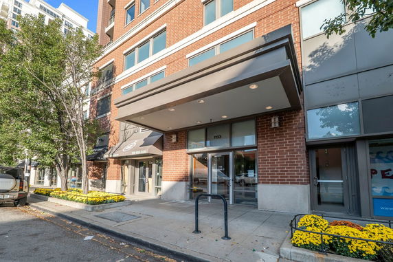 Front view of a multi-story building with a modern entrance.