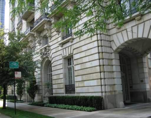 Front view of a multi-story building with ornate architecture.
