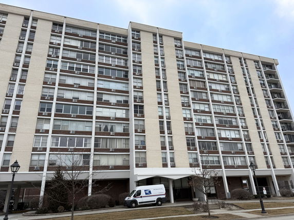 Front view of a multi-story apartment building.