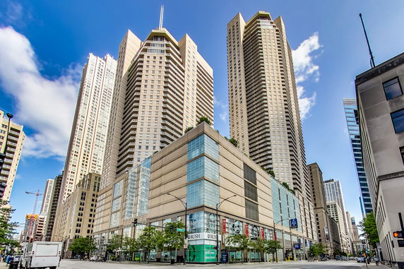 Front view of a tall modern building complex with multiple high-rise towers.