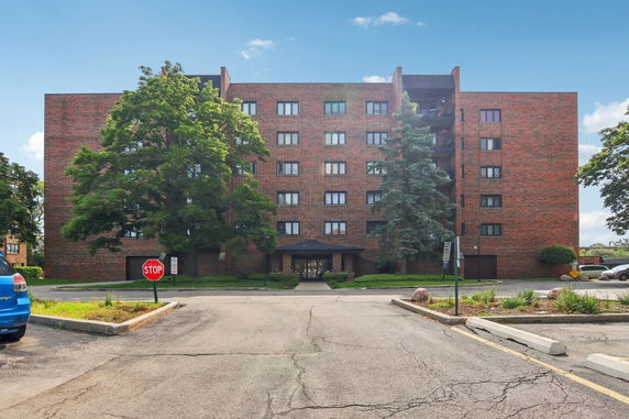 Front view of a multi-story brick building.