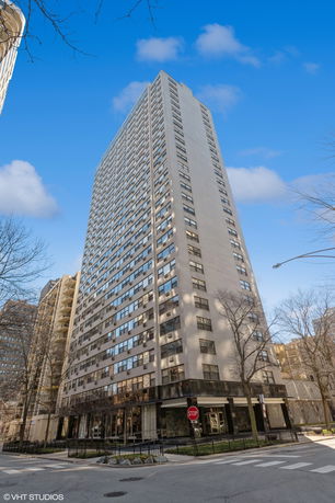 Front view of a high-rise apartment building with numerous windows.