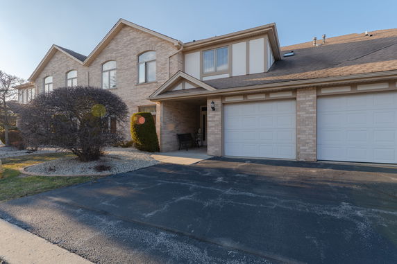 Front view of a two-story house with a double garage.