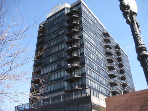Front view of a multi-story building with balconies.