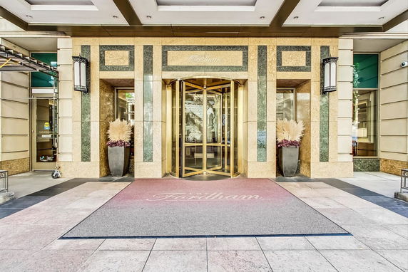 Front view of a building entrance with a revolving door.