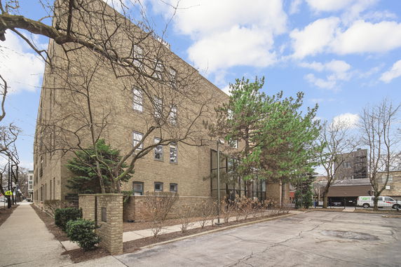Front view of a multi-story brick building.