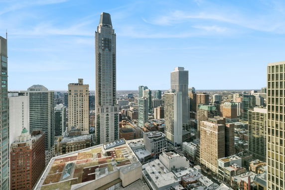 Panoramic view of a city skyline featuring multiple high-rise buildings.
