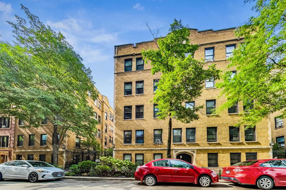 Front view of a multi-story brick residential building.