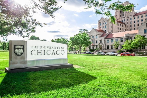 Front view of a building with a large sign for The University of Chicago.