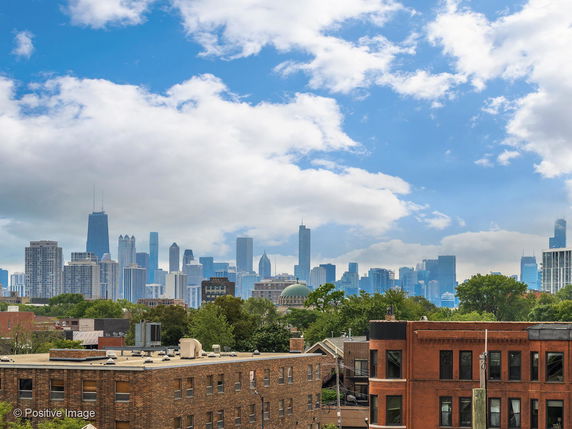 Panoramic view of a city skyline with various skyscrapers and buildings.