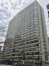 Front view of a high-rise building with multiple floors.