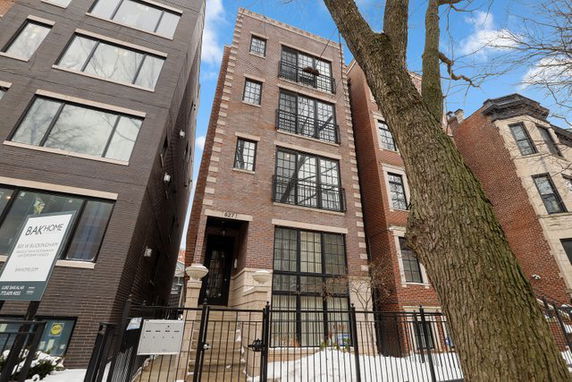 Front view of a multi-story brick building.