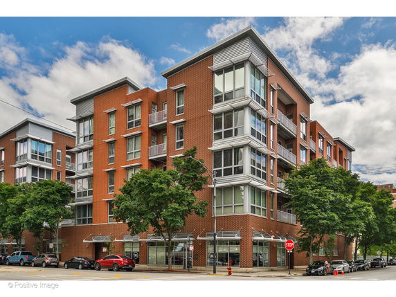 Front view of a multi-story brick apartment building