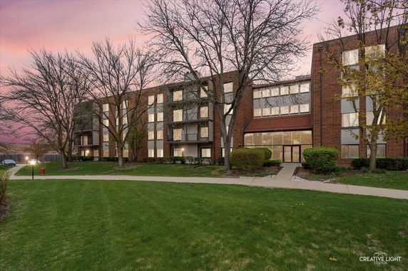 Front view of a multi-story brick residential building.
