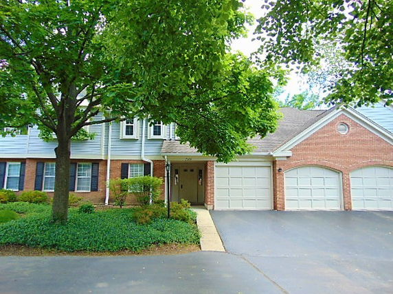 Front view of a two-story house with a double garage.