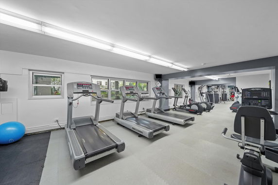 Indoor gym area with treadmills and fitness equipment.