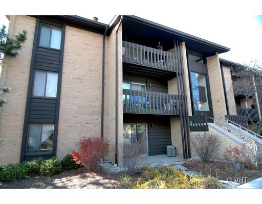 Front view of a multi-story building with balconies.