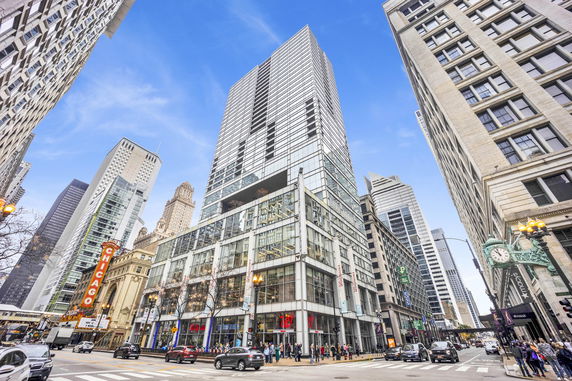 Front view of a modern high-rise building in an urban setting.