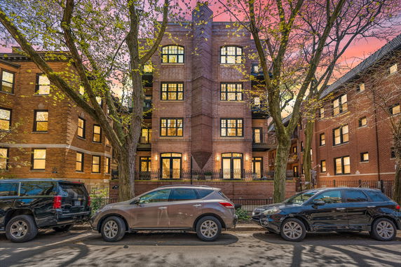 Front view of a multi-story brick apartment building