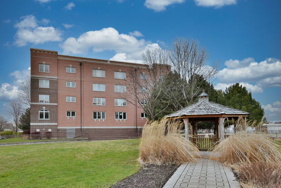 Front view of a four-story brick building.