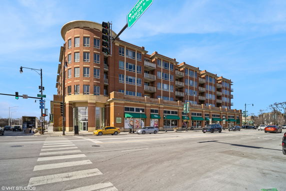 Front view of a multi-story commercial building with brick facade.