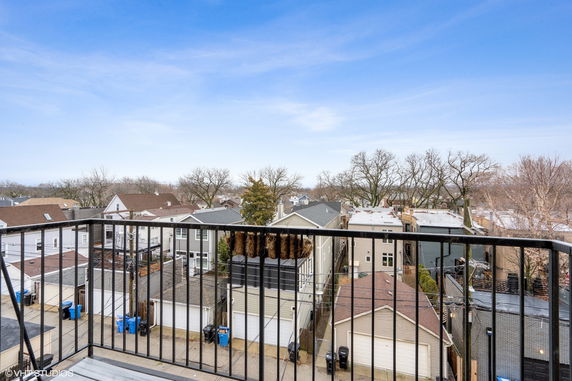 Panoramic view of residential neighborhood from a balcony.
