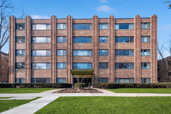 Front view of a multi-story brick building.