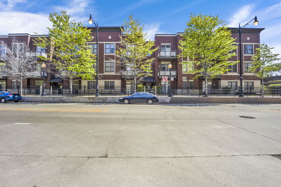 Front view of a multi-story brick building.