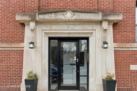 Front view of an apartment building entrance.