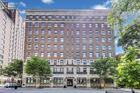 Front view of a multi-story brick building.