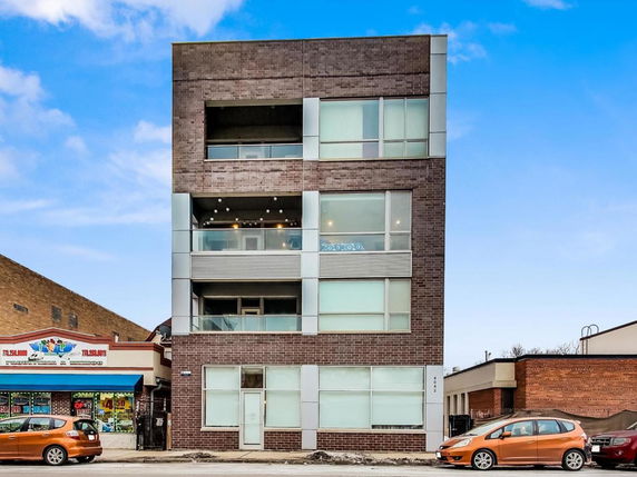 Front view of a multi-story building with a modern design.