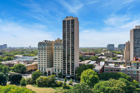 Front view of tall residential and office buildings in a city landscape.