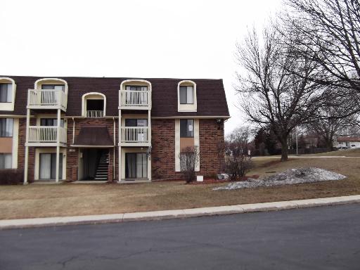 Exterior view of a two-story building with multiple balconies.