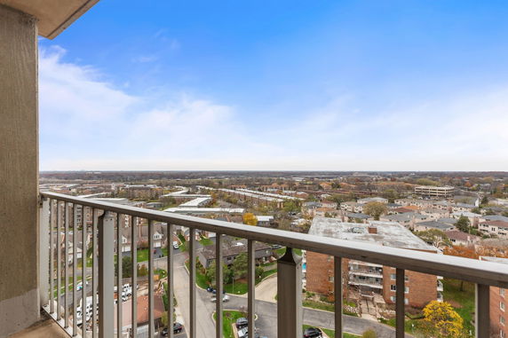 Panoramic view of residential neighborhood from a high balcony.