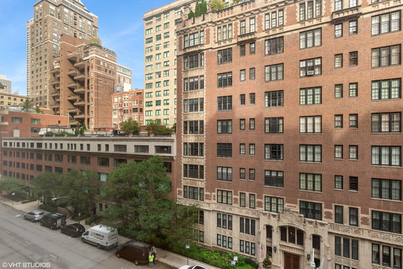 Front view of multiple multi-story residential buildings with brick facades.