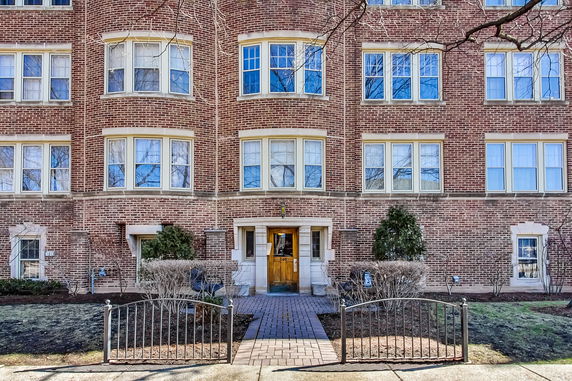 Front view of a brick multi-story apartment building