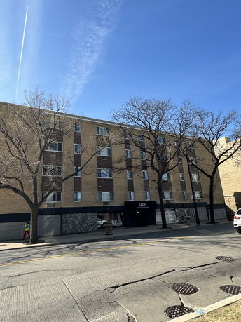 Front view of a multi-story apartment building.