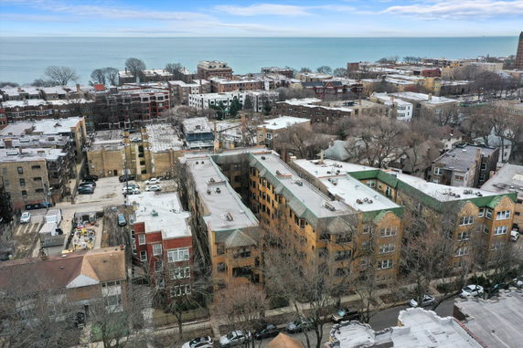 Panoramic view of buildings and surrounding area near a body of water.