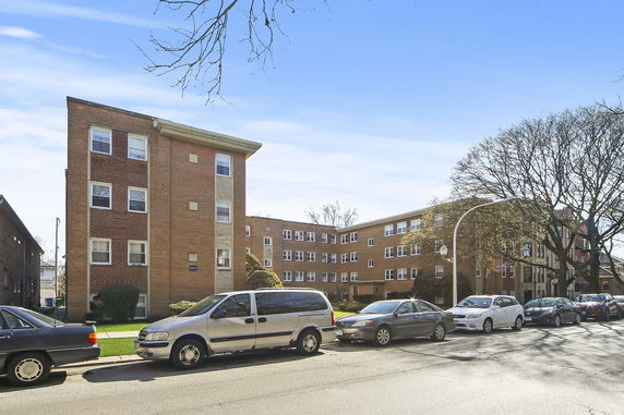Front view of a multi-story brick apartment building